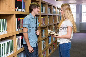 Students discussing in the library