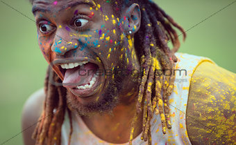Hipster covered in powder paint