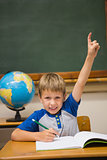 Pupils raising hand in classroom