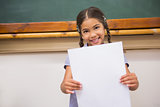 Smiling pupil showing paper