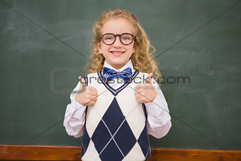 Happy pupil looking at camera with thumbs up