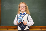 Smiling pupil holding calculator