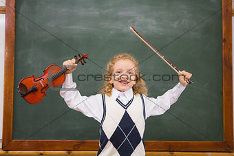 Cute pupil holding violin and violin string