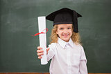 Pupil with graduation hat and holding her diploma
