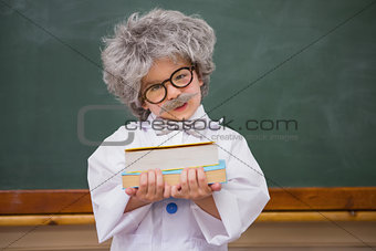 Dressed up pupil holding books