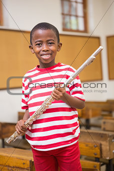 Happy pupil holding flute