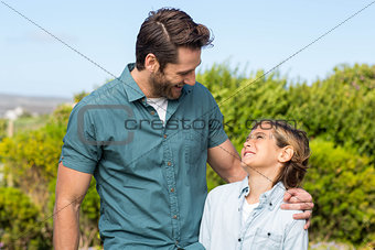 Father and son smiling at each other