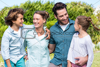 Happy family smiling at each other