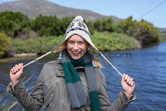 Happy casual woman at a lake