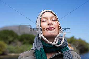 Happy casual woman at a lake