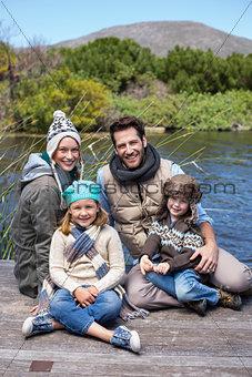 Happy casual family at a lake