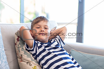 Little boy smiling on the couch