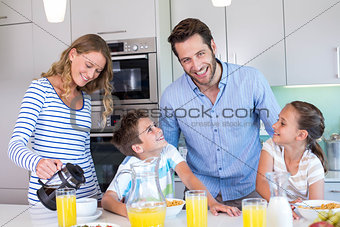 Happy family having breakfast together