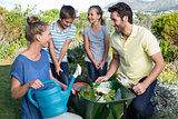 Happy young family gardening together