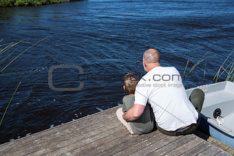 Happy man sitting with his son