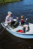 Happy man fishing with his son