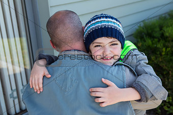 Father and son hugging