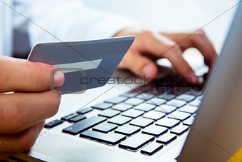 Man using laptop for online shopping