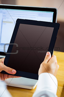 Man using laptop and tablet