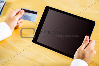 Man using tablet pc for online shopping
