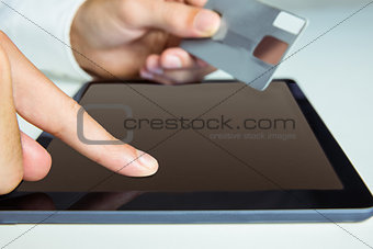 Man using tablet for online shopping