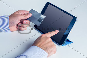 Man using tablet for online shopping