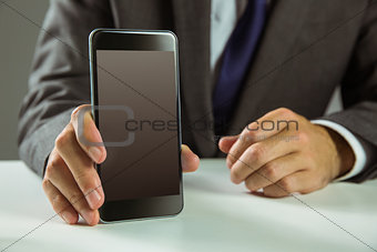 Businessman showing his smart phone