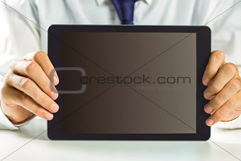 Businessman showing his tablet pc