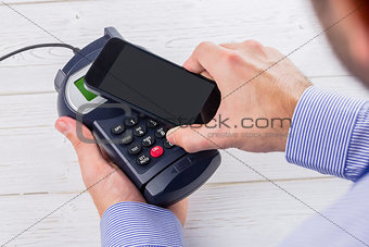 Man using smartphone to express pay