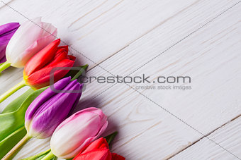 Tulips on wooden table