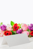 Colorful tulips and white card
