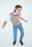 Geeky hipster dancing and smiling