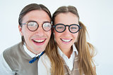 Geeky hipsters smiling at camera
