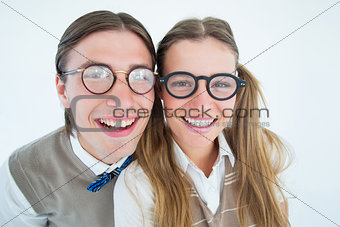 Geeky hipsters smiling at camera