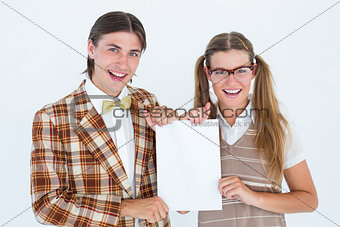 Geeky hipsters holding a poster