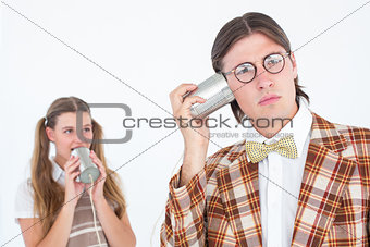 Geeky hipsters using string phone