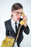 Focused geeky businessman on the phone
