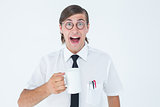 Geeky businessman holding a mug
