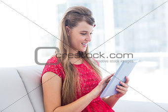 Pretty hipster using her tablet computer