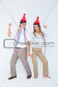 Happy geeky couple dancing