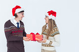 Geeky hipster couple holding present