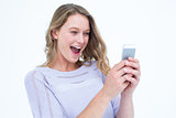Smiling woman using smartphone