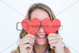 Woman holding heart cards