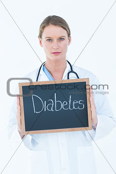 Doctor holding blackboard