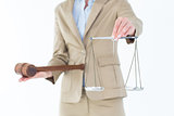 Young woman holding scales of justice and a gavel
