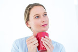 Businesswoman holding her mug and thinking