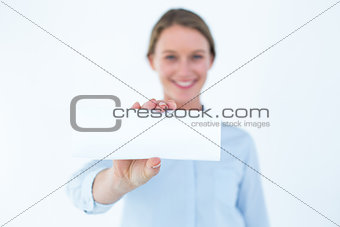 Businesswoman showing her business card