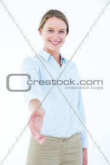 Smiling businesswoman offering handshake