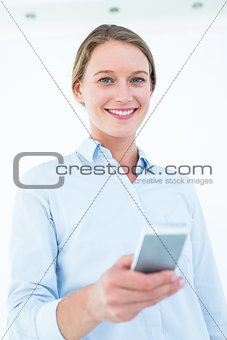 Businesswoman using her mobile phone