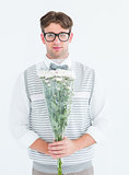 Geeky hipster offering bunch of flowers
